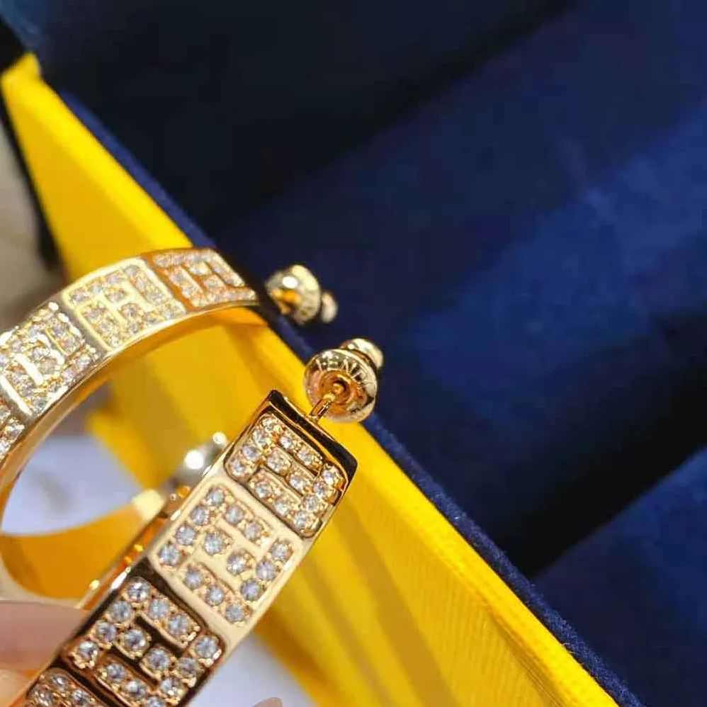 Fendi Hoop Earrings with FF Motif Gold for Women in colored Fendi Hoop Earrings with FF Motif Gold for Women in colored