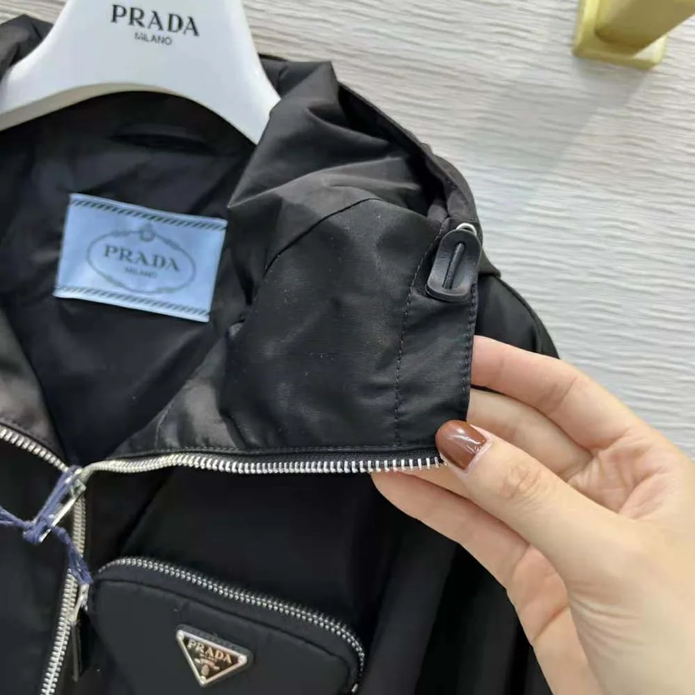 Prada Re-Nylon Hooded Blouson Jacket with Pouch for Women in Black Prada Re-Nylon Hooded Blouson Jacket with Pouch for Women in Black