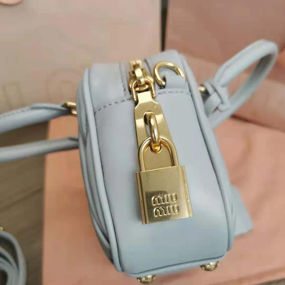 Miu Miu Matelassé Nappa Leather Top-Handle Bag for Women in Silver Miu Miu Matelassé Nappa Leather Top-Handle Bag for Women in Silver