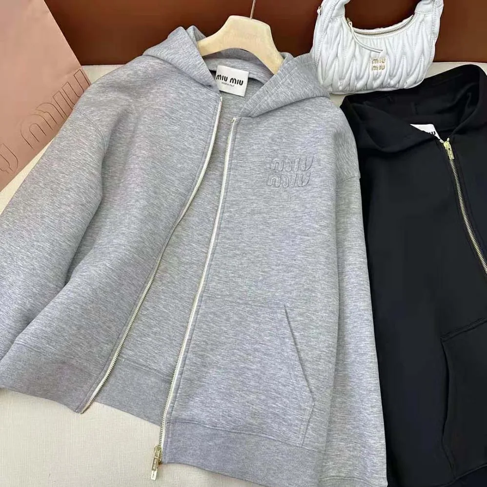 Miu Miu Embroidered Cotton Fleece Hoodie with Embroidered Logo for Women in Silver Miu Miu Embroidered Cotton Fleece Hoodie with Embroidered Logo for Women in Silver