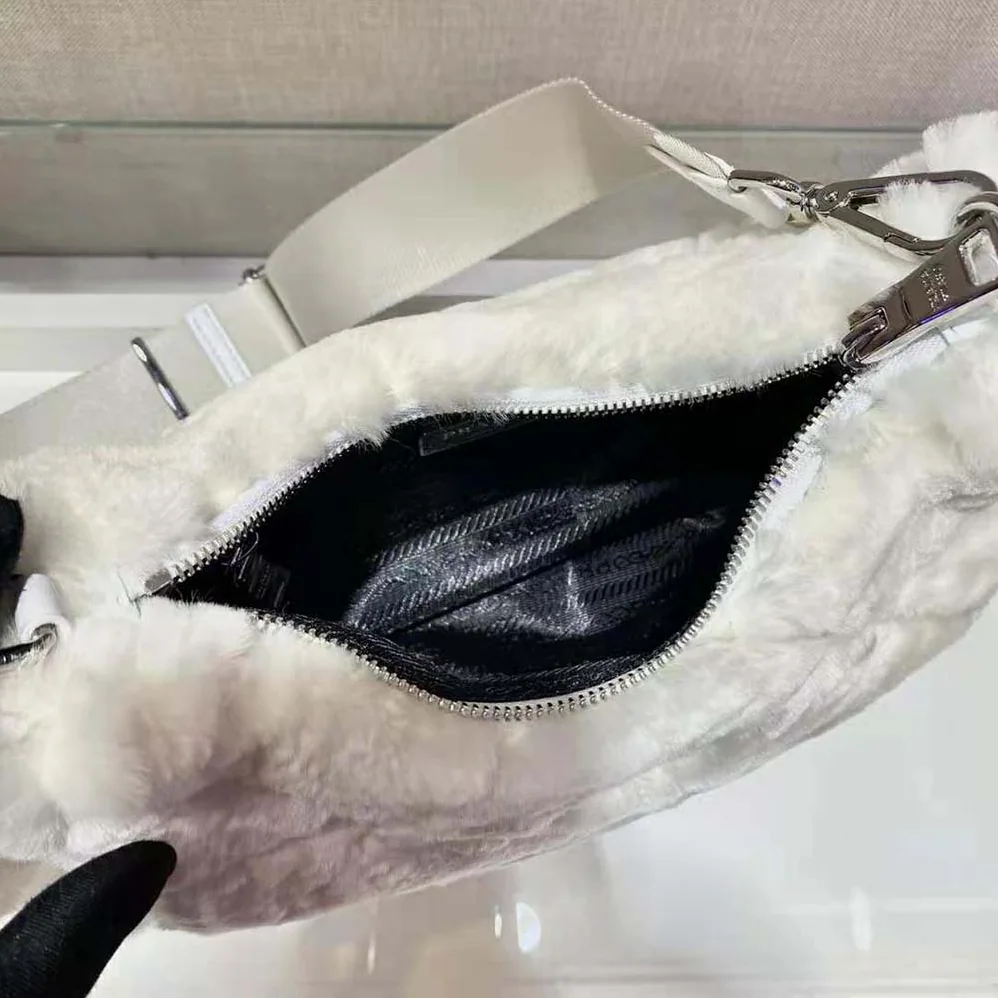 Prada A Patchwork-style Triangle Motif Characterizes Shearling Shoulder Bag for Women Prada A Patchwork-style Triangle Motif Characterizes Shearling Shoulder Bag for Women