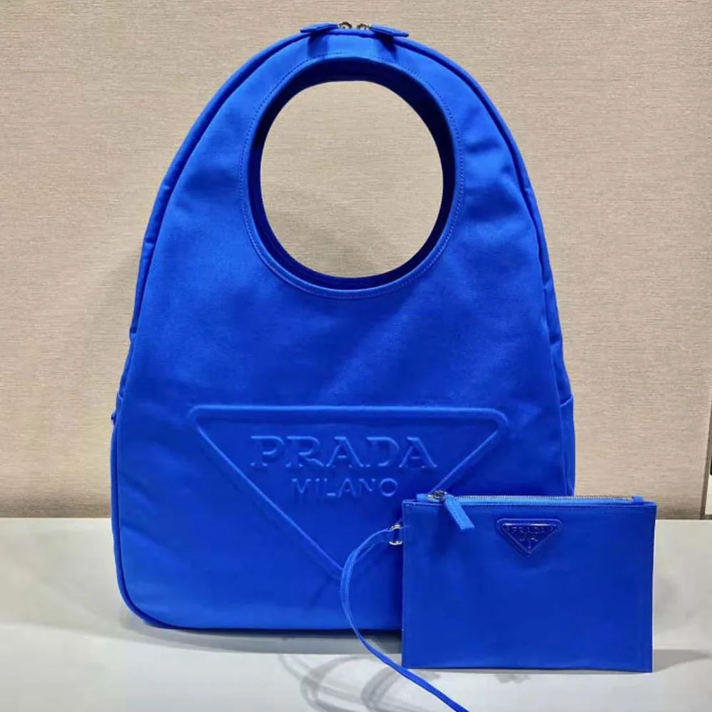 Prada Canvas Hobo Bag with Embossed Logo on the Front for Men in Blue Prada Canvas Hobo Bag with Embossed Logo on the Front for Men in Blue
