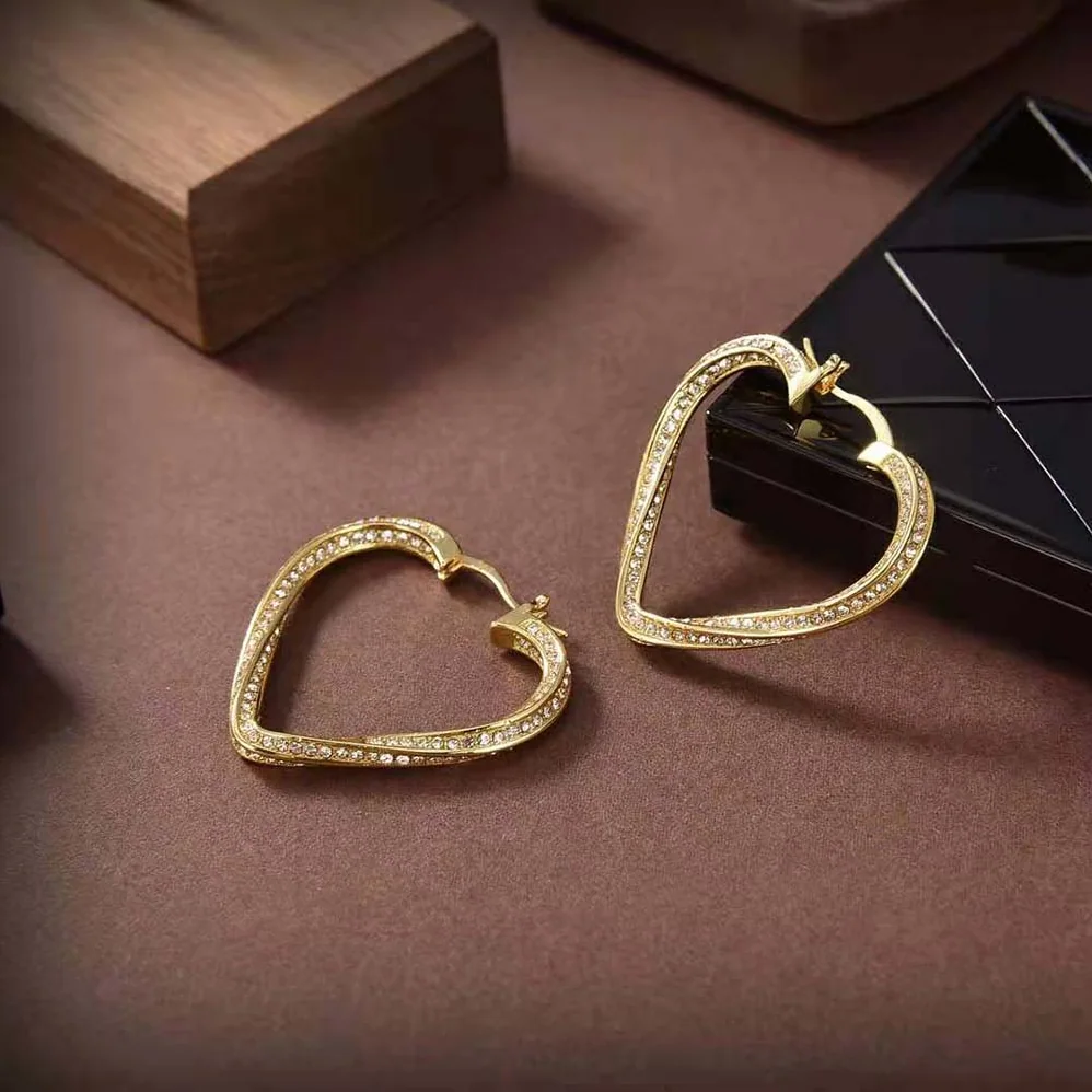 Saint Laurent YSL Smoking Twisted Heart Hoop Earrings in Metal and Crystal for Women Saint Laurent YSL Smoking Twisted Heart Hoop Earrings in Metal and Crystal for Women