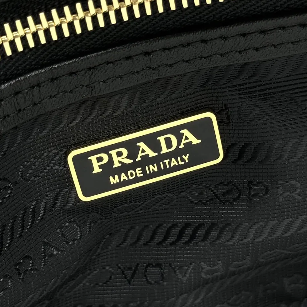Prada Re-Nylon and Leather Small Top for Women in handle Bag with Padlock Prada Re-Nylon and Leather Small Top for Women in handle Bag with Padlock