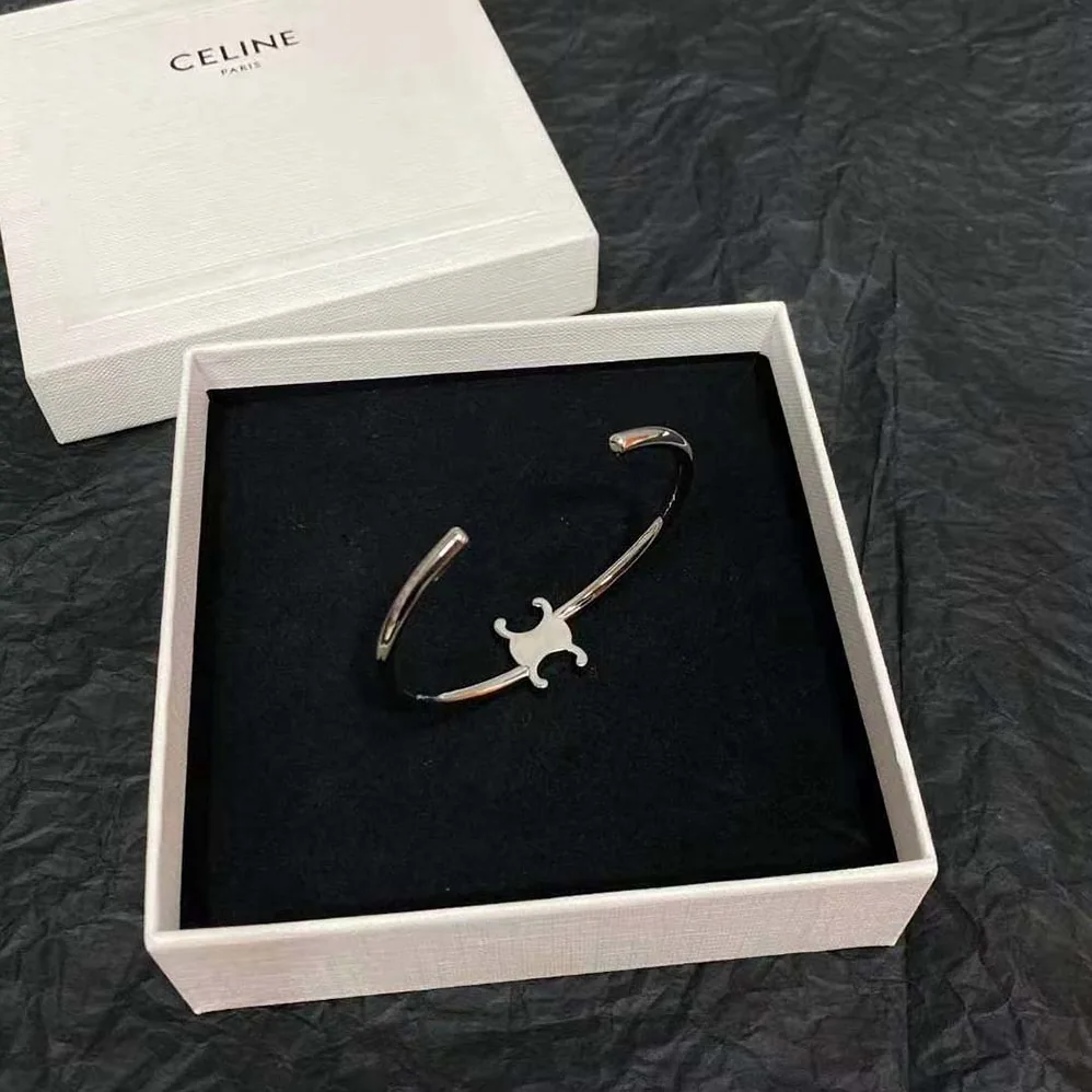 Celine Triomphe Asymmetric Cuff in Brass with Rhodium Finish for Women