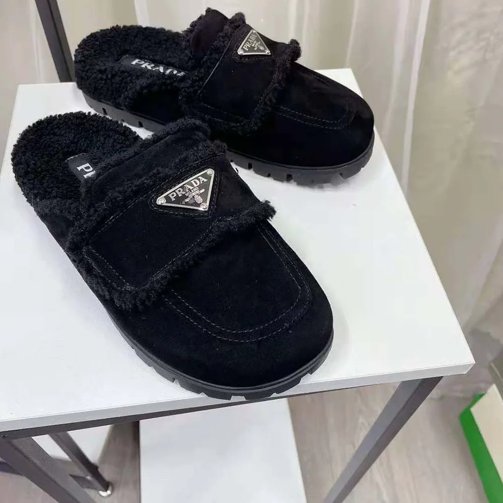 Prada Shearling Slippers Enameled Metal Triangle Logo for Women in Black