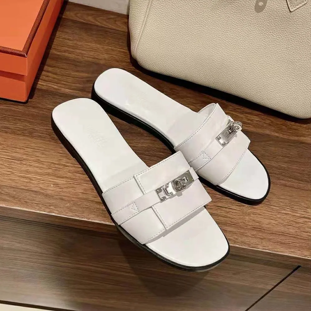 Hermes Giulia Sandal in Calfskin with Iconic Palladium-Plated Kelly Buckle for Women in White Hermes Giulia Sandal in Calfskin with Iconic Palladium-Plated Kelly Buckle for Women in White