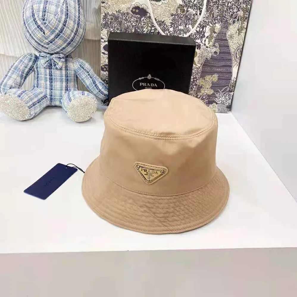 Prada Nylon Bucket Hat Decorated with the Triangle Logo for Women in Sandy Prada Nylon Bucket Hat Decorated with the Triangle Logo for Women in Sandy