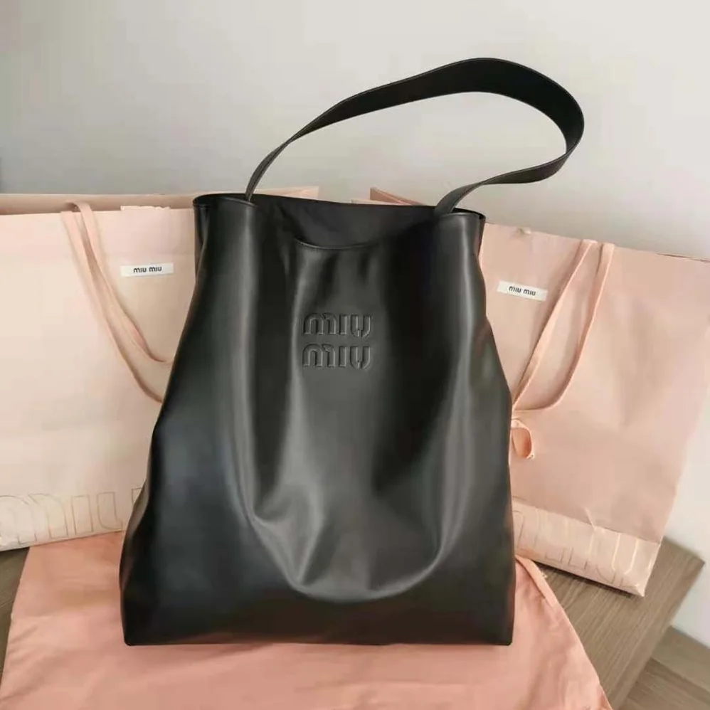 Miu Miu Leather Shoulder Bag with Embossed Lettering Logo on the Front for Women