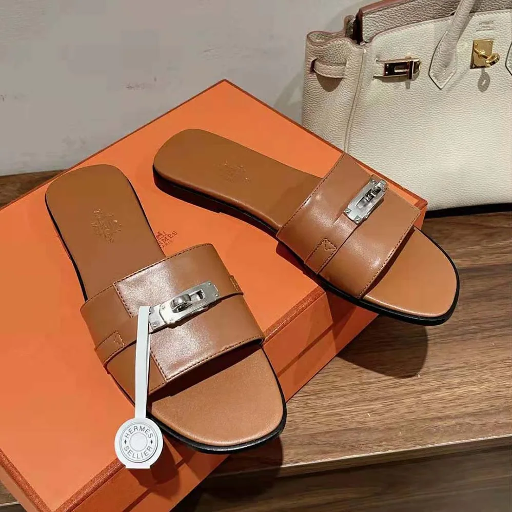 Hermes Giulia Sandal in Calfskin with Iconic Palladium-Plated Kelly Buckle for Women in Brown Hermes Giulia Sandal in Calfskin with Iconic Palladium-Plated Kelly Buckle for Women in Brown