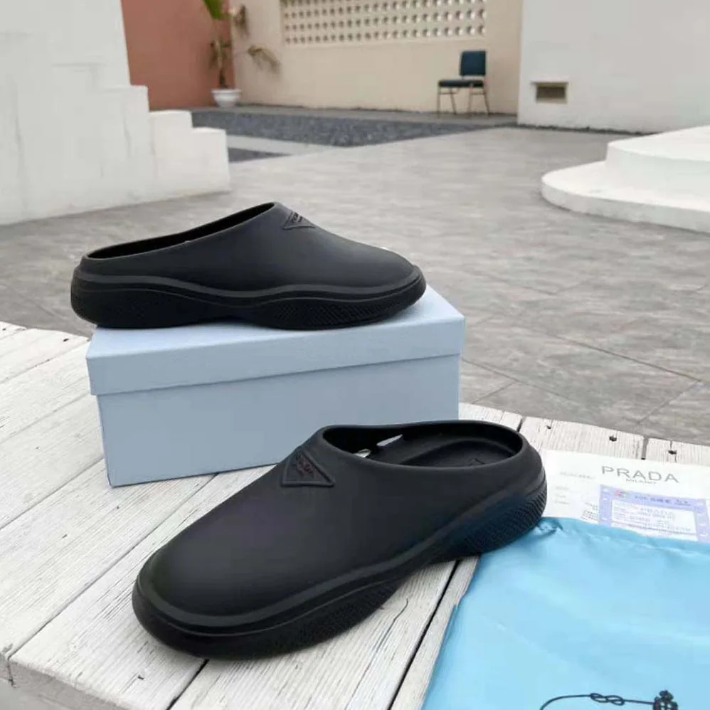 Prada Foam Rubber Mules With Embossed Rubber Triangle Logo for Women in Black Prada Foam Rubber Mules With Embossed Rubber Triangle Logo for Women in Black