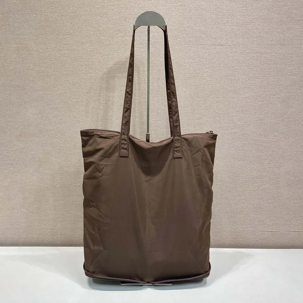 Prada Saffiano Leather Pendant With Re-Nylon Tote Bag for Women in Sienna Prada Saffiano Leather Pendant With Re-Nylon Tote Bag for Women in Sienna