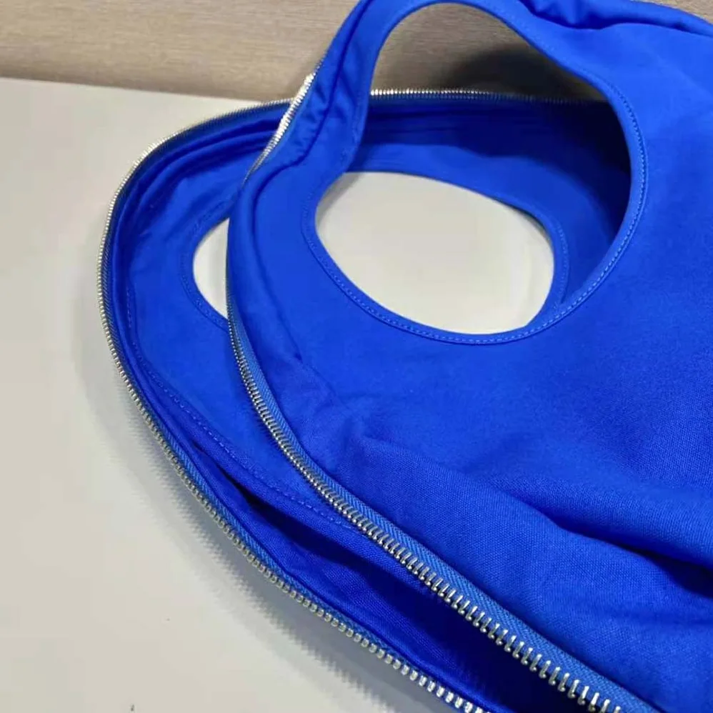 Prada Canvas Hobo Bag with Embossed Logo on the Front for Men in Blue Prada Canvas Hobo Bag with Embossed Logo on the Front for Men in Blue