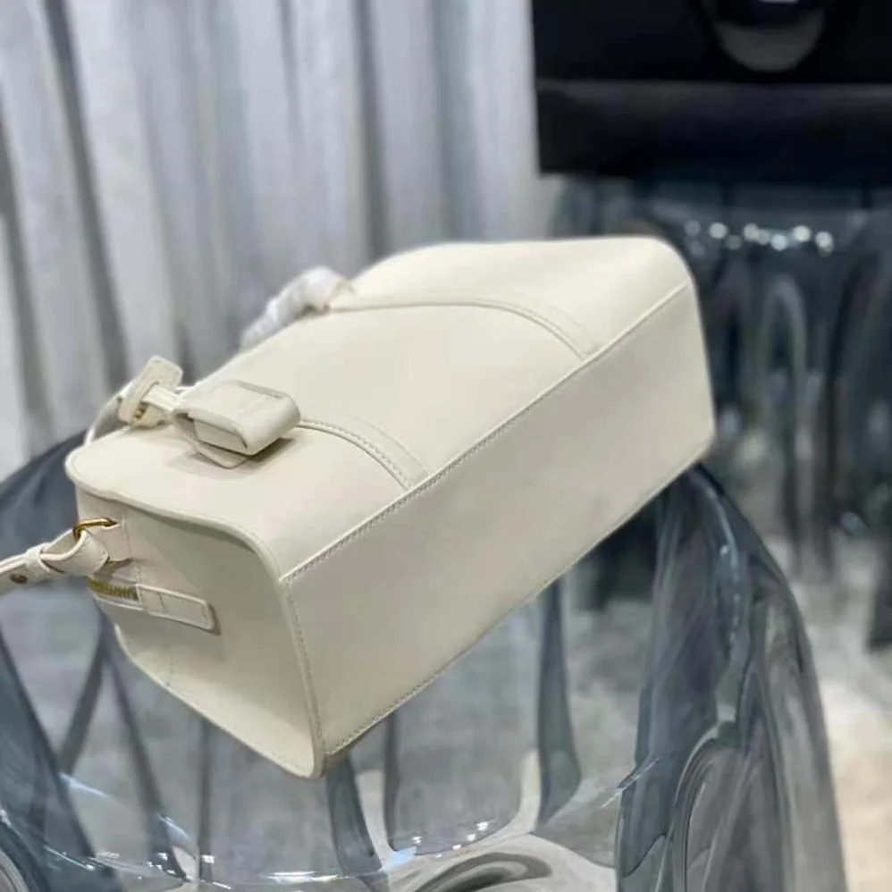 Saint Laurent YSL Lock Baby Duffle in Smooth Leather for Women in White Saint Laurent YSL Lock Baby Duffle in Smooth Leather for Women in White