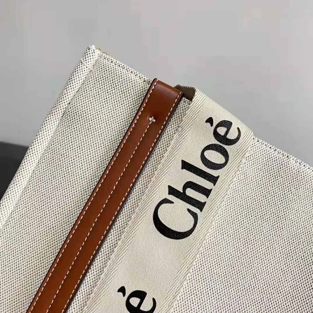 Chloe Large Woody Tote Bag in Linen Canvas and Shiny Calfskin with Woody Ribbon for Women Chloe Large Woody Tote Bag in Linen Canvas and Shiny Calfskin with Woody Ribbon for Women