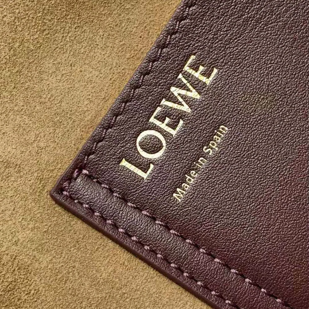 Loewe Mini Pebble Bucket Bag in Mellow Calfskin for Unisex in Maroon