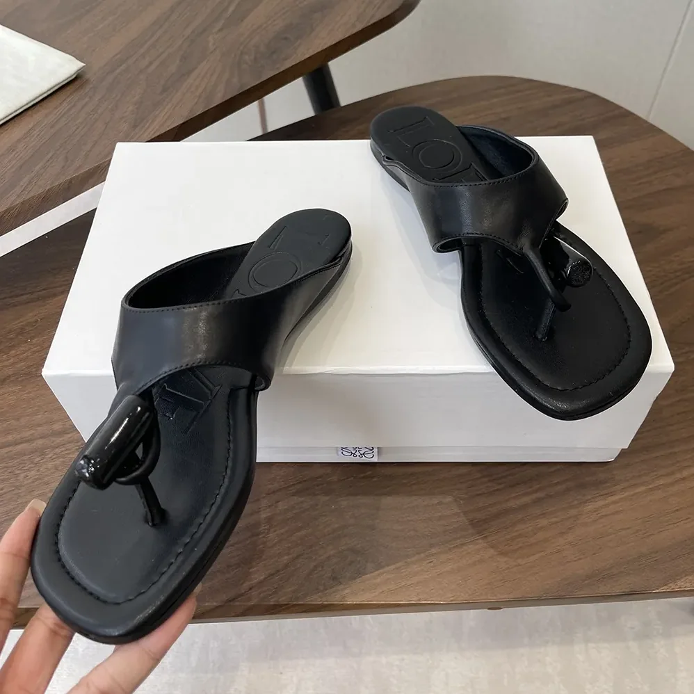 Loewe Toggle Flat Sandal in Shiny Smoot Calfskin for Women in Black Loewe Toggle Flat Sandal in Shiny Smoot Calfskin for Women in Black