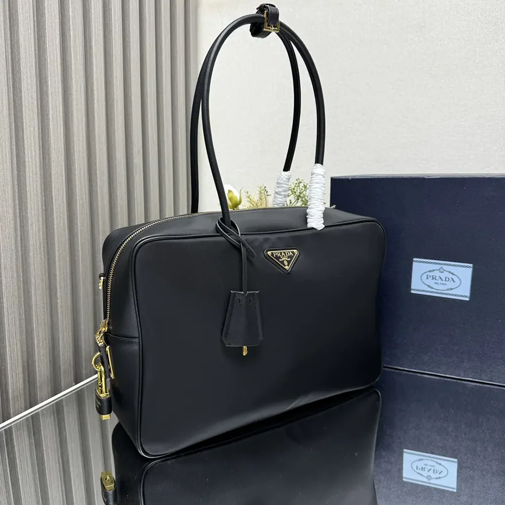 Prada Large Re-Nylon and Leather Top for Women in handle Bag with Padlock Prada Large Re-Nylon and Leather Top for Women in handle Bag with Padlock