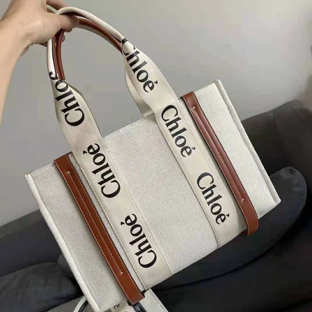 Chloe Large Woody Tote Bag in Linen Canvas and Shiny Calfskin with Woody Ribbon for Women Chloe Large Woody Tote Bag in Linen Canvas and Shiny Calfskin with Woody Ribbon for Women