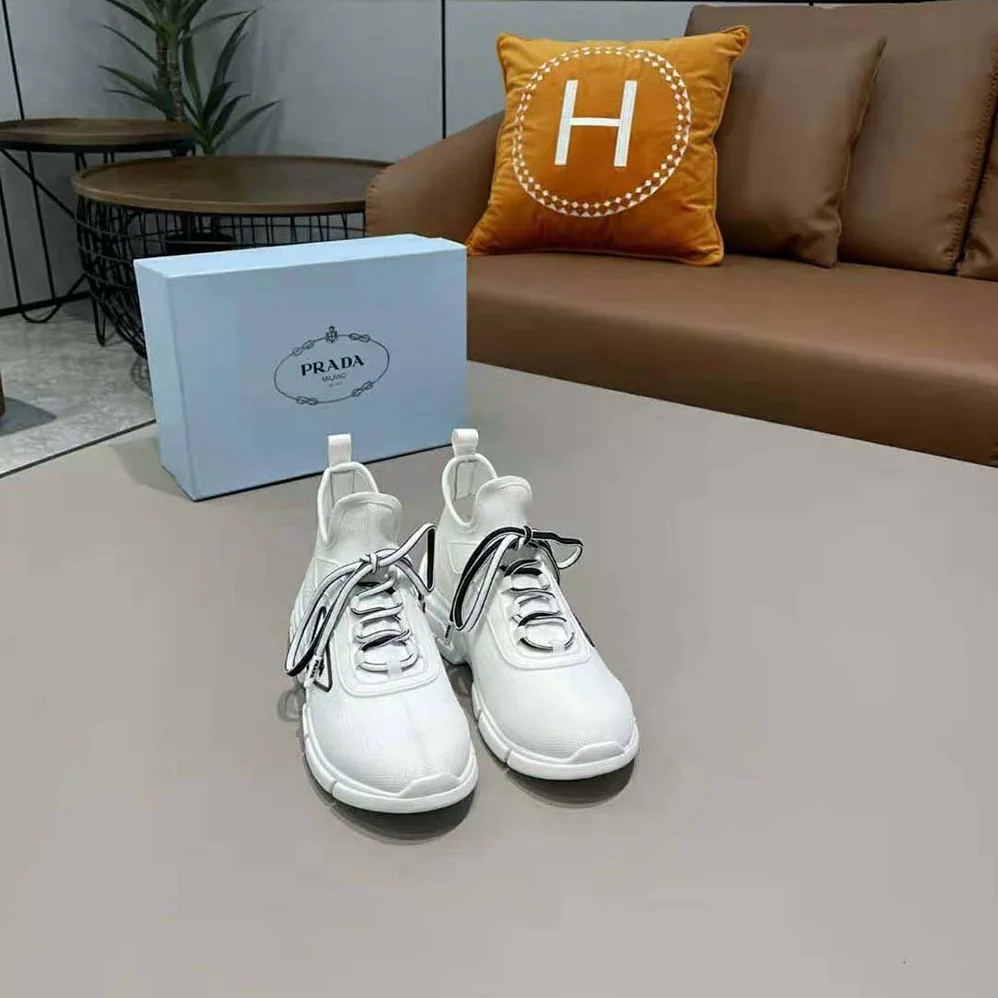 Prada The Triangle Logo Decorates These Knit Fabric Sneakers for Women in White Prada The Triangle Logo Decorates These Knit Fabric Sneakers for Women in White