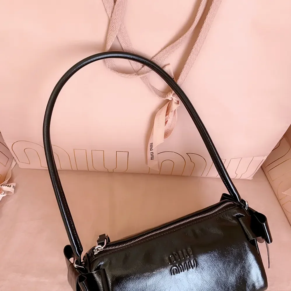 Miu Miu Shiny Leather Pouch for Women in Black Miu Miu Shiny Leather Pouch for Women in Black
