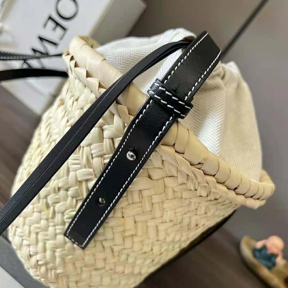 Loewe Drawstring Bucket Bag in Palm Leaf and Calfskin for Women in Black