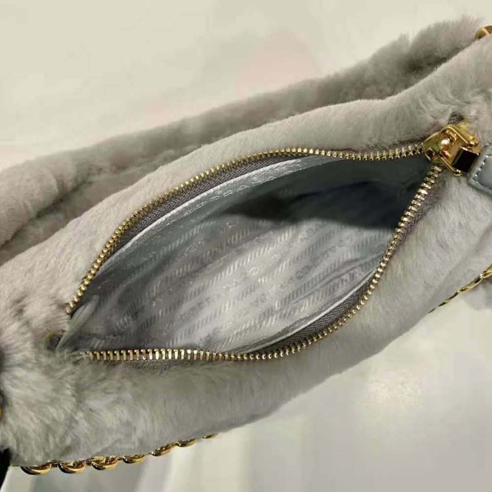 Prada Shearling Mini-Bag with the Enameled Metal Triangle Logo for Women in Silver