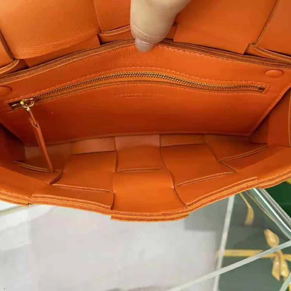Bottega Veneta Cassette Intreccio Leather Cross-Body Bag for Women in Orange Bottega Veneta Cassette Intreccio Leather Cross-Body Bag for Women in Orange