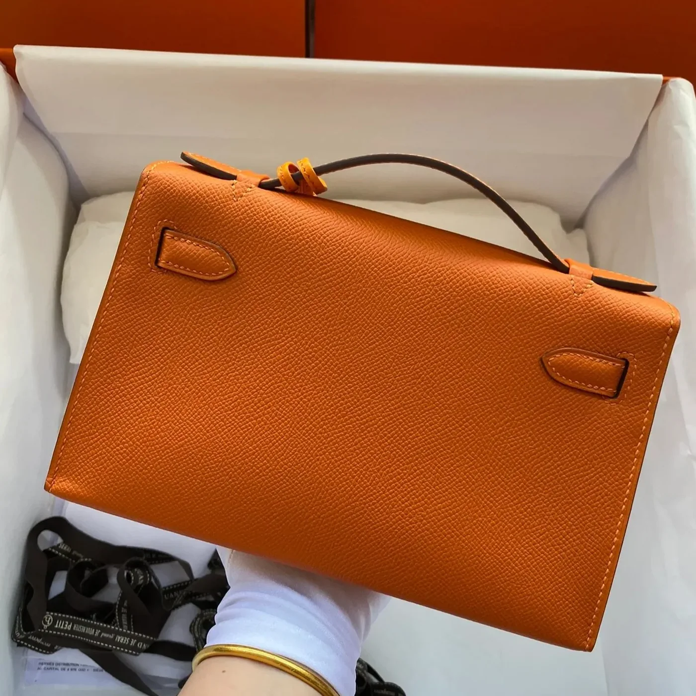 Hermes Kelly Pochette Top Handle Bag in Orange Epsom Gold Hardware