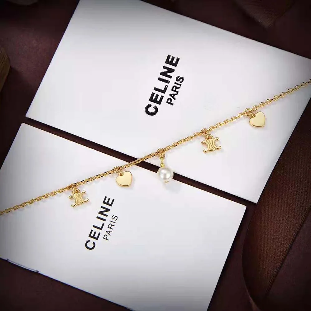 Celine Cœur Celine Charms Bracelet in Brass with Gold Finish and Resin Pearl for Women