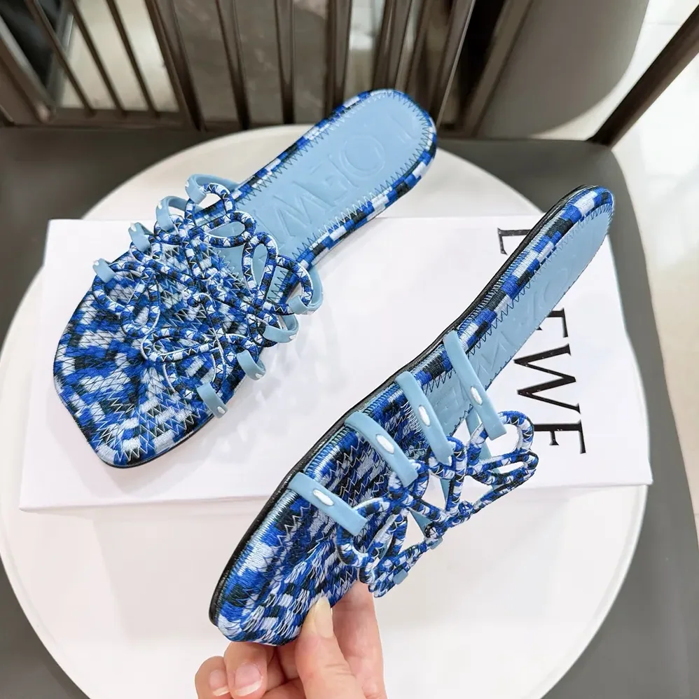 Loewe Petal Anagram Slide in Embroidered Canvas for Women in Baby Blue Loewe Petal Anagram Slide in Embroidered Canvas for Women in Baby Blue