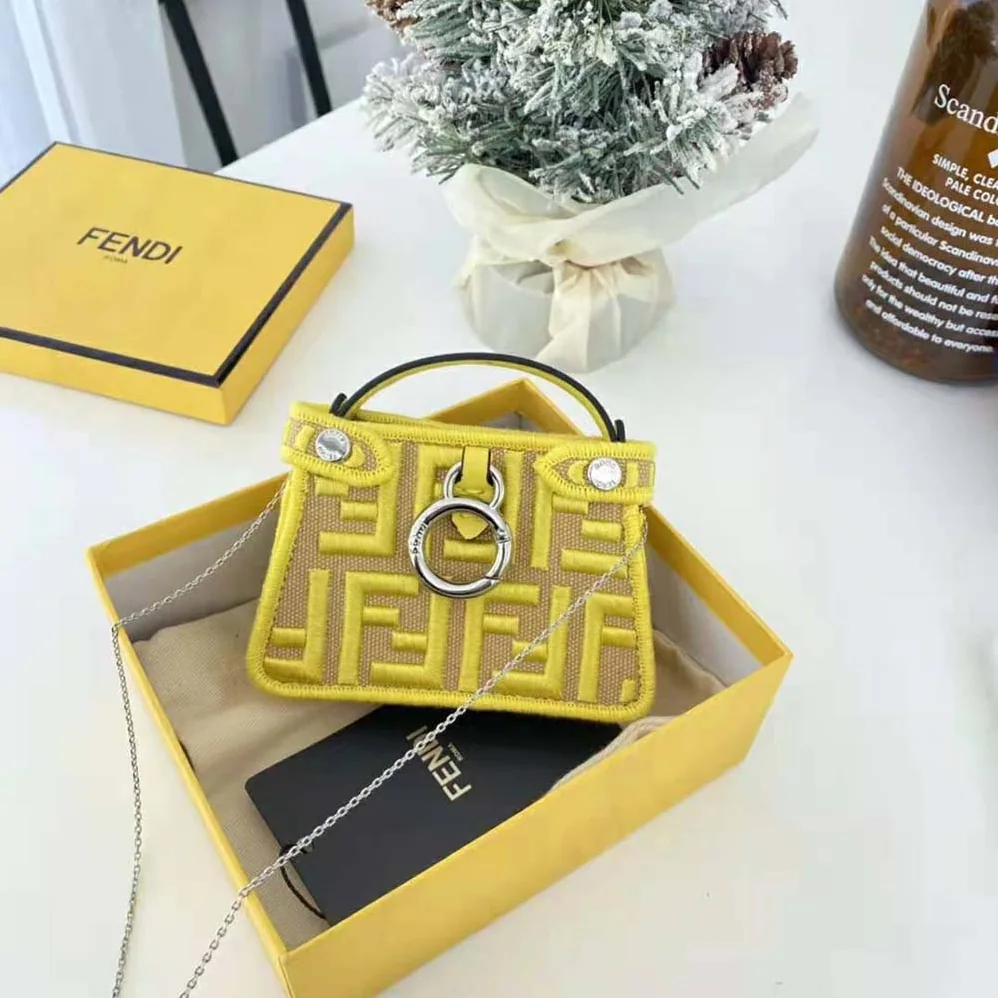 Fendi Nano Peekaboo Charm Gray FF Canvas Charm for Women in Yellow Fendi Nano Peekaboo Charm Gray FF Canvas Charm for Women in Yellow