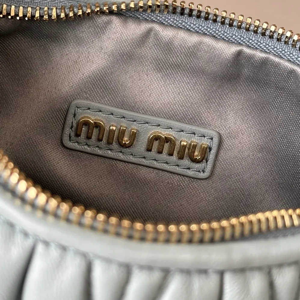 Miu Miu Wander Matelassé Nappa Leather Hobo Bag for Women in Powder Blue Miu Miu Wander Matelassé Nappa Leather Hobo Bag for Women in Powder Blue