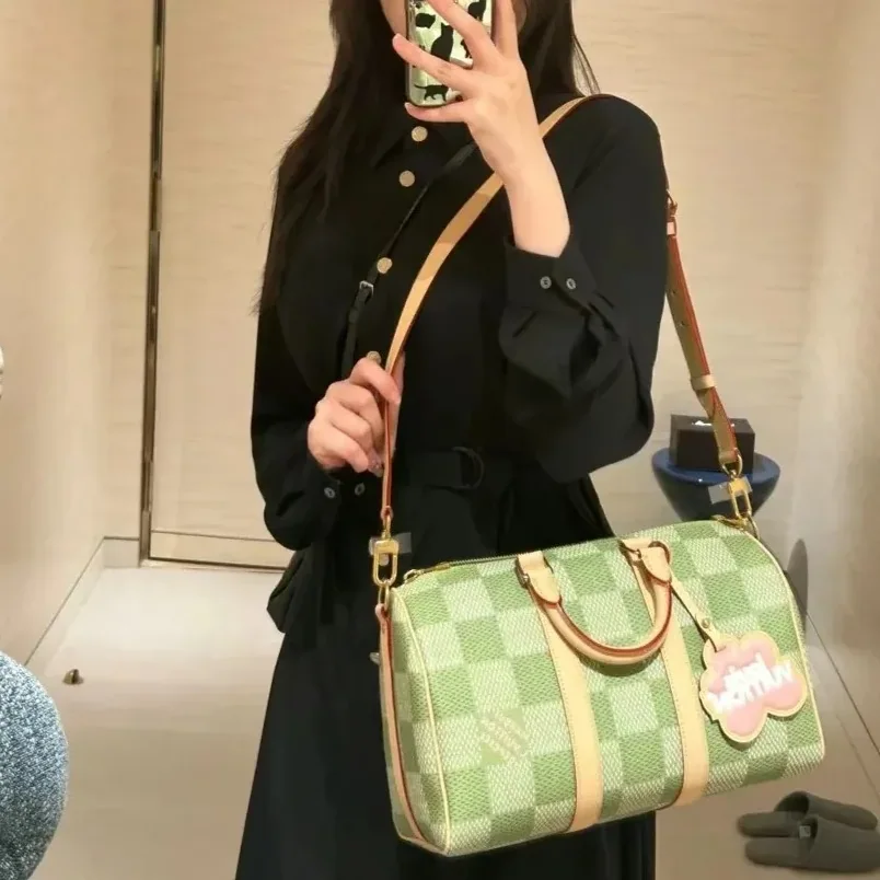 Louis Vuitton Keepall Bandouliere 35 Travel Bag in Green Gold Hardware