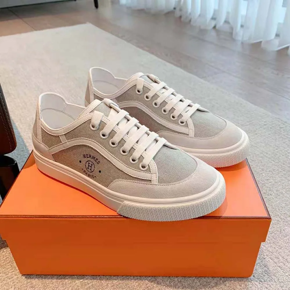 Hermes Get Sneaker in SH Canvas and Calfskin with Signature “Hermès Paris” Stencil for Unisex in Silver Hermes Get Sneaker in SH Canvas and Calfskin with Signature “Hermès Paris” Stencil for Unisex in Silver