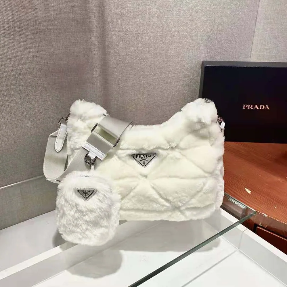 Prada A Patchwork-style Triangle Motif Characterizes Shearling Shoulder Bag for Women Prada A Patchwork-style Triangle Motif Characterizes Shearling Shoulder Bag for Women