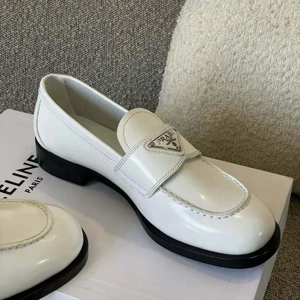 Prada Patent Leather Loafers in 25 mm Heel Height for Women in White Prada Patent Leather Loafers in 25 mm Heel Height for Women in White