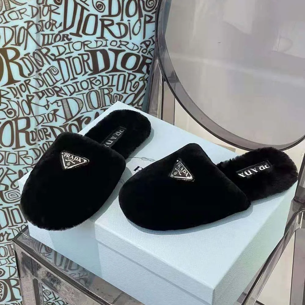 Prada Enameled Triangle Logo Accentuates Shearling Sabots for Women