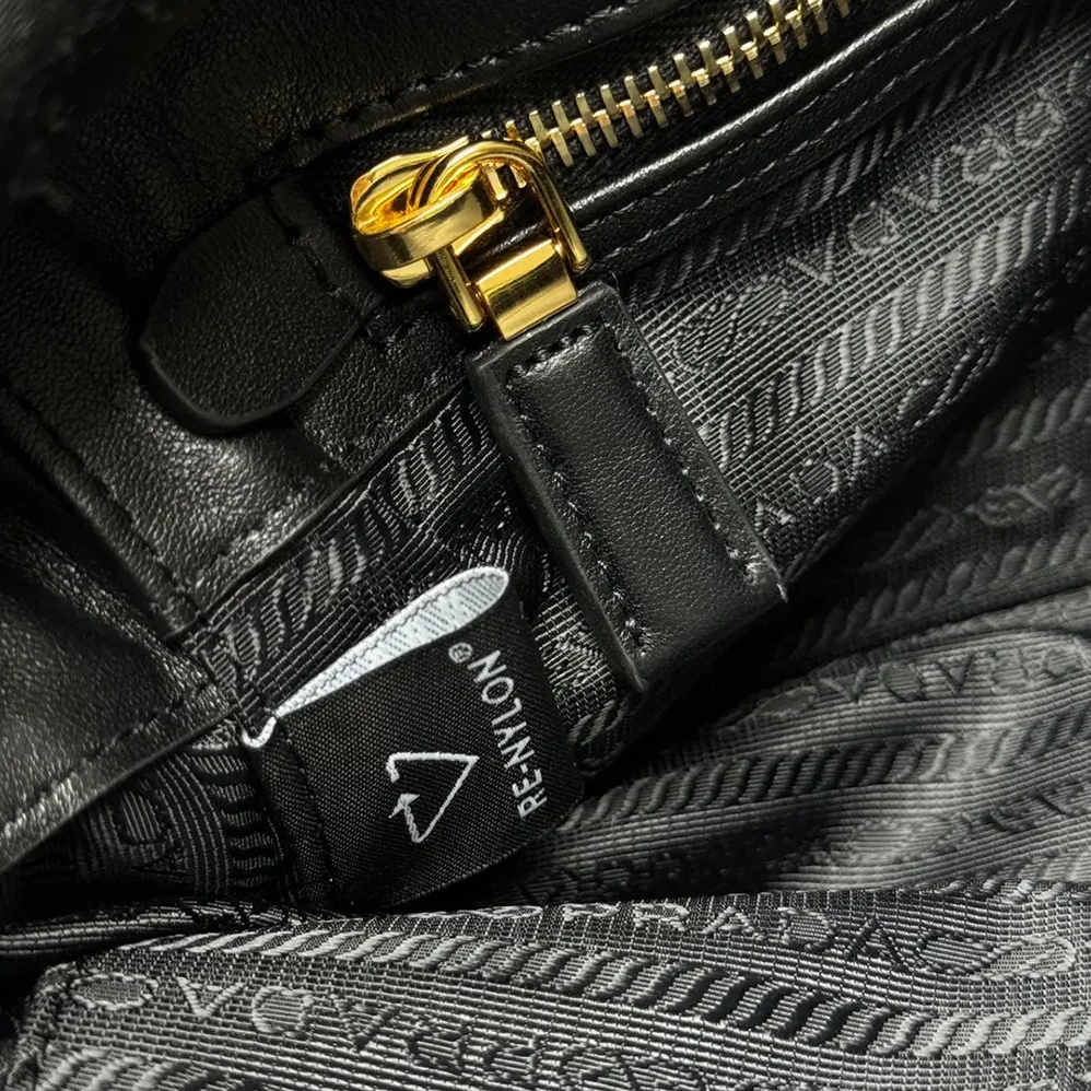 Prada Re-Nylon and Leather Small Top for Women in handle Bag with Padlock Prada Re-Nylon and Leather Small Top for Women in handle Bag with Padlock