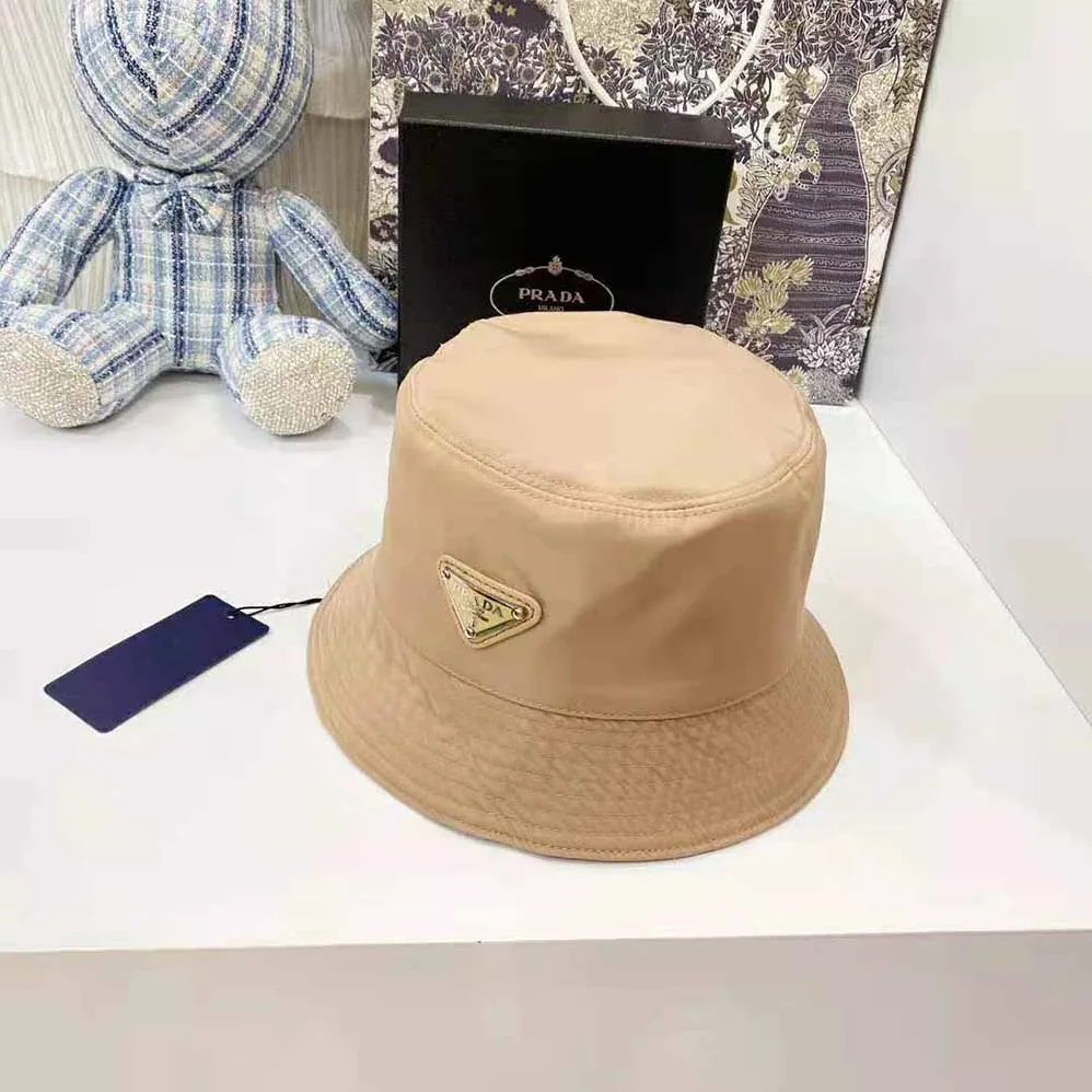 Prada Nylon Bucket Hat Decorated with the Triangle Logo for Women in Sandy Prada Nylon Bucket Hat Decorated with the Triangle Logo for Women in Sandy