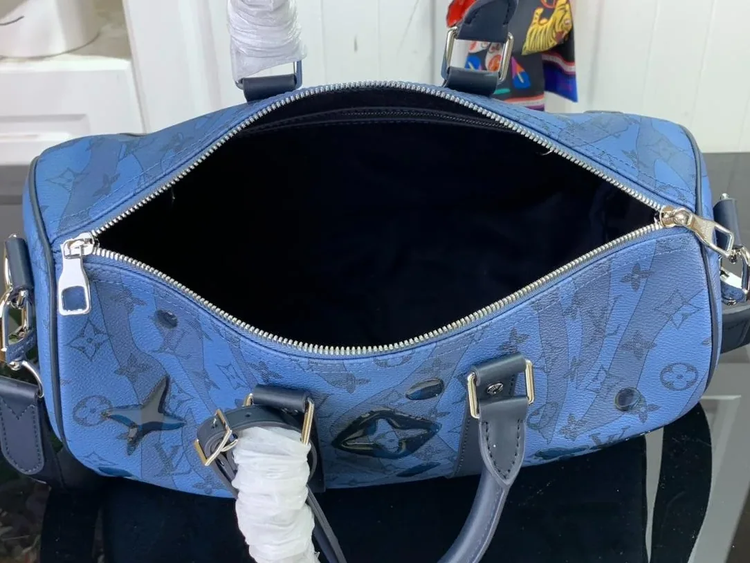 Louis Vuitton Keepall Bandouliere 35 Travel Bag in Blue Silver Hardware