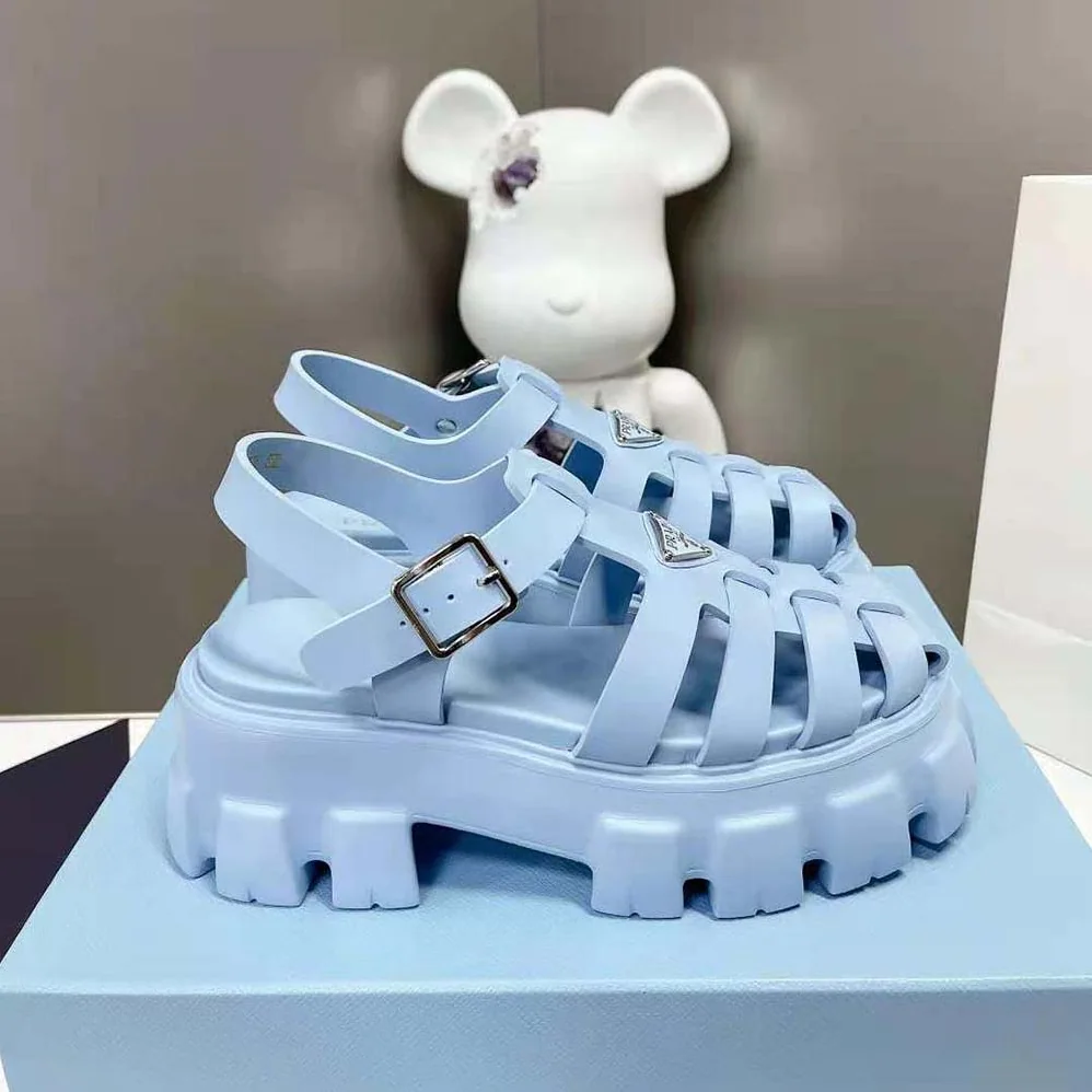Prada Foam Rubber Sandals with Enameled Metal Triangle Logo for Women in Blue Prada Foam Rubber Sandals with Enameled Metal Triangle Logo for Women in Blue