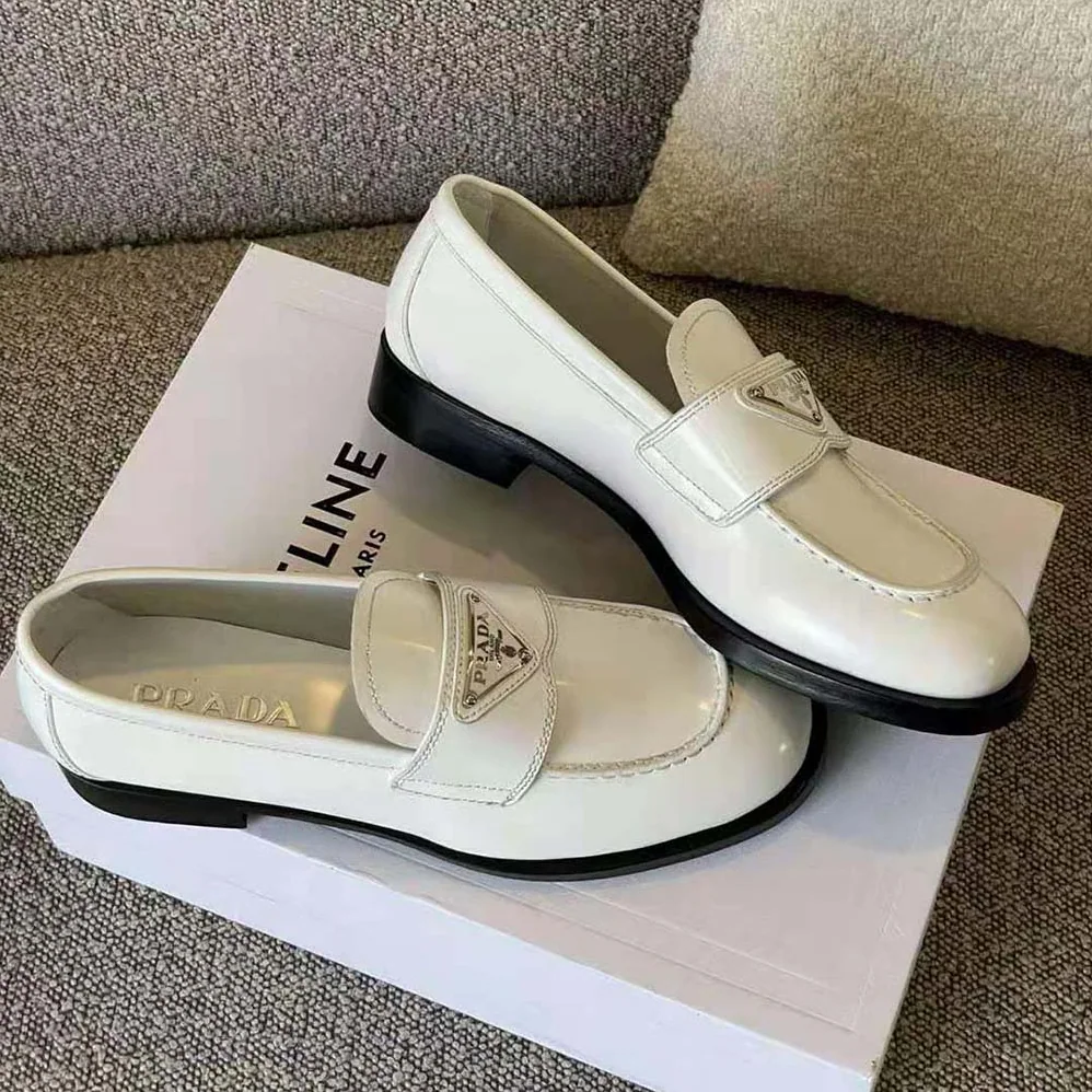 Prada Patent Leather Loafers in 25 mm Heel Height for Women in White Prada Patent Leather Loafers in 25 mm Heel Height for Women in White