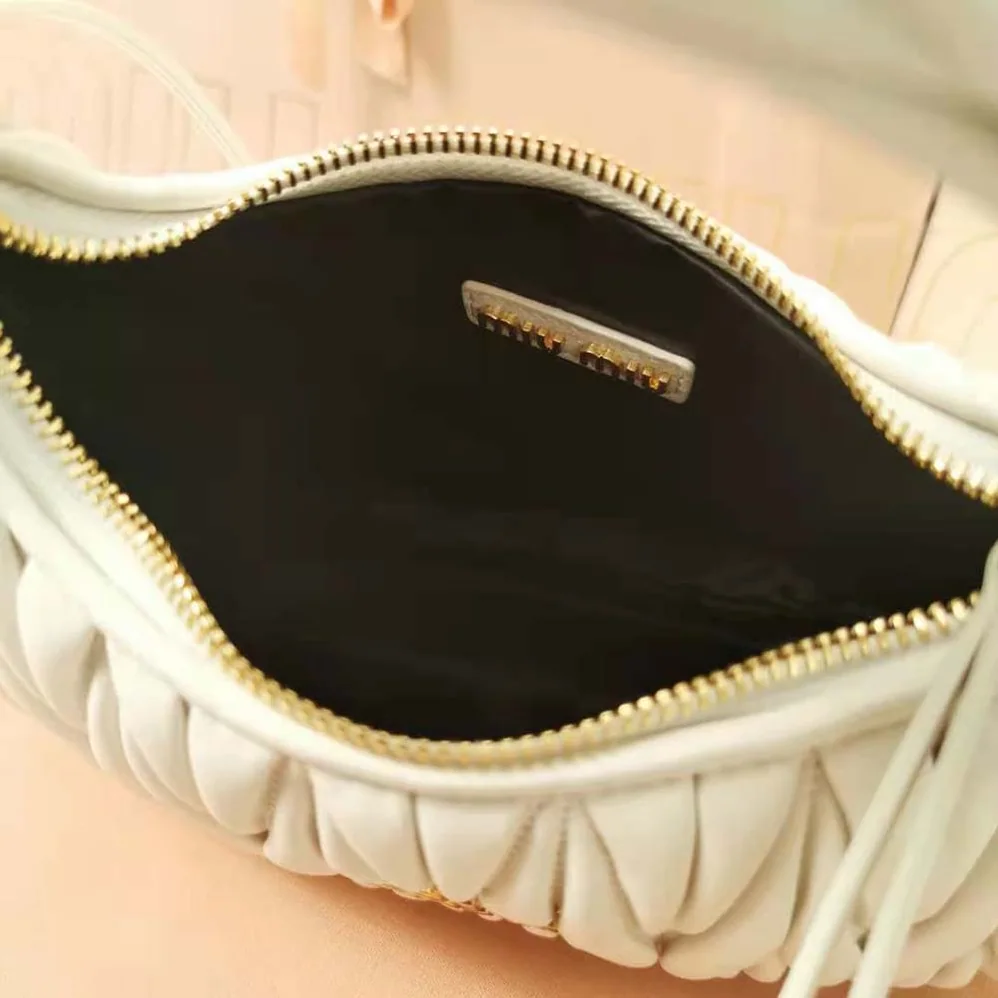 Miu Miu Wander Matelassé Nappa Leather Hobo Bag for Women in White Miu Miu Wander Matelassé Nappa Leather Hobo Bag for Women in White