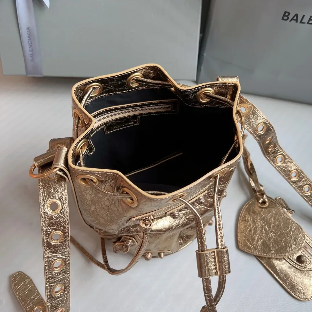 Balenciaga Le Cagole Xs Bucket Bag Metallized With Rhinestones In Gold Tone / Balenciaga Le Cagole Xs Bucket Bag Metallized With Rhinestones In Gold Tone /