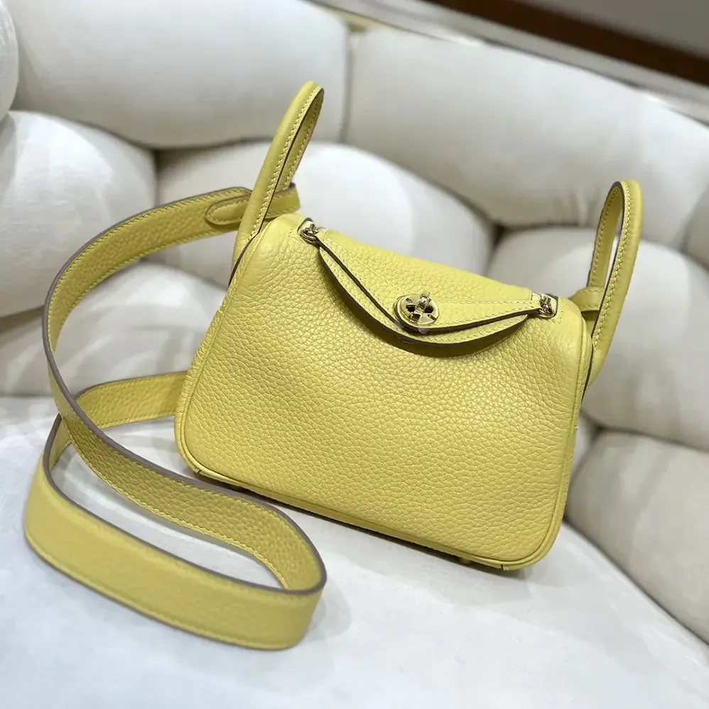 Hermes Lindy Mini 19 in Clemence Leather for Women in Yellow/Gold Hermes Lindy Mini 19 in Clemence Leather for Women in Yellow/Gold