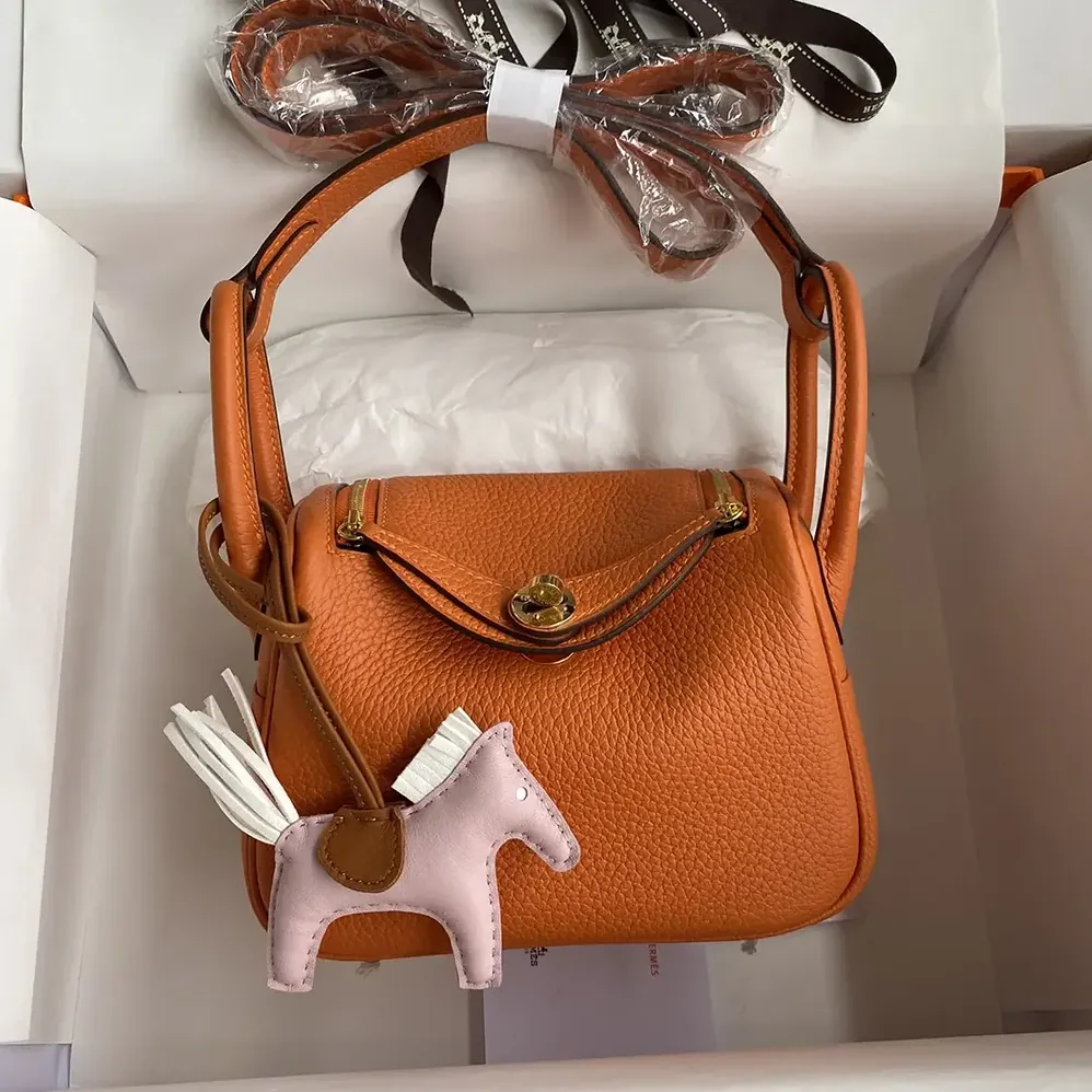 Hermes Lindy Mini 19 in Clemence Leather for Women in Orange/Gold Hermes Lindy Mini 19 in Clemence Leather for Women in Orange/Gold