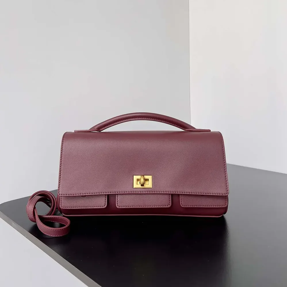 Balenciaga Bel Air Clutch On Strap Small in Dark Burgundy for Women Balenciaga Bel Air Clutch On Strap Small in Dark Burgundy for Women