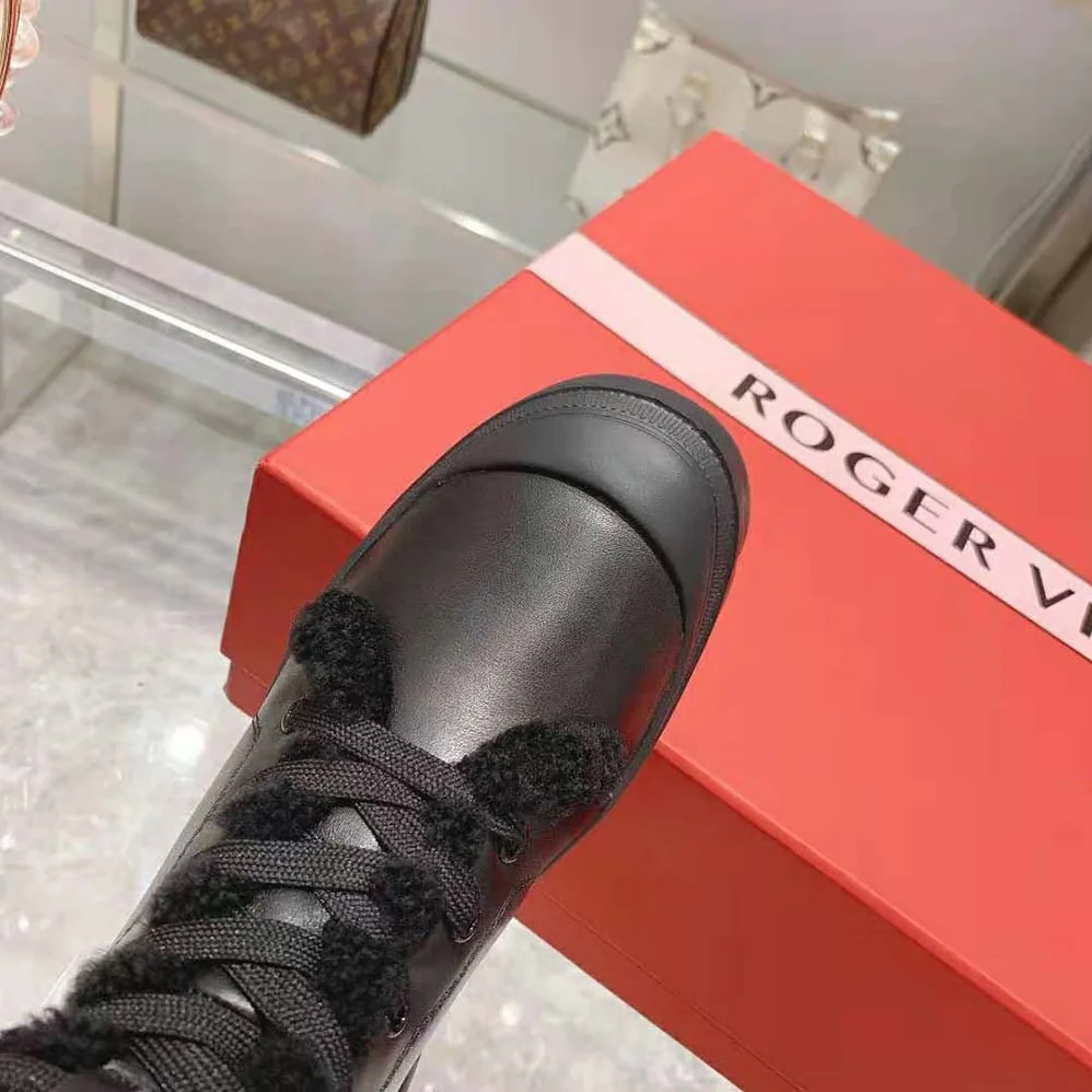Roger Vivier Walky Viv' Shearling Strass Buckle Boots in Leather for Women in Black Roger Vivier Walky Viv' Shearling Strass Buckle Boots in Leather for Women in Black