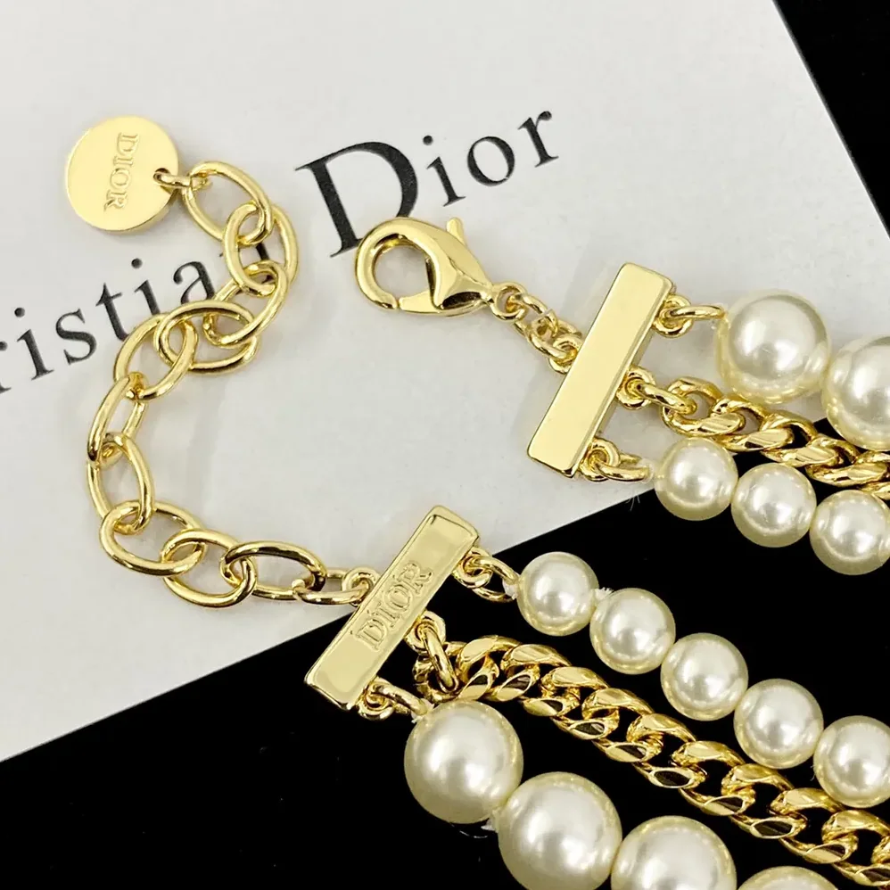 Dior Le Nœud de Dior Bracelet Gold-Finish Metal with White Resin Pearls and Black Satin for Women Dior Le Nœud de Dior Bracelet Gold-Finish Metal with White Resin Pearls and Black Satin for Women